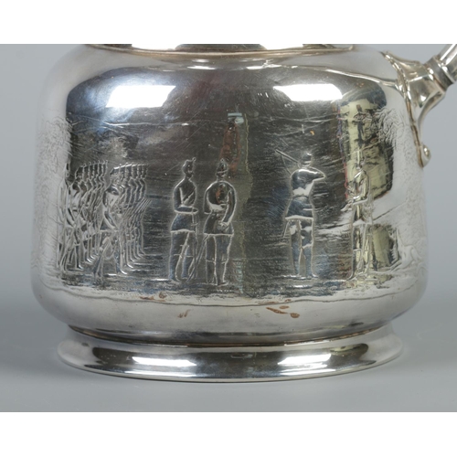 32 - A silver plated hot water pot decorated with military figures. 25cm.