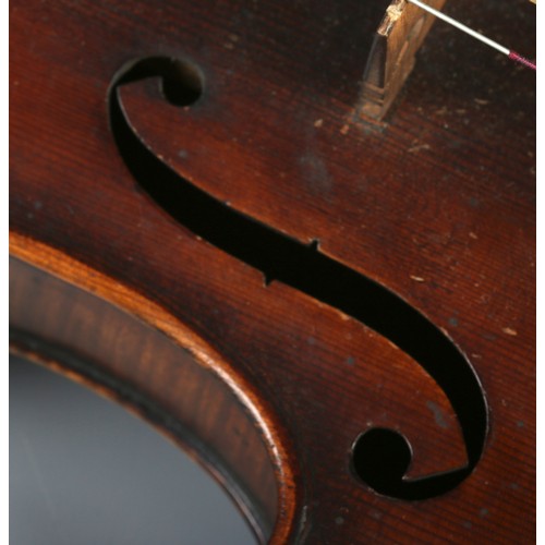 79 - A  19th century two piece back violin, labelled for Joseph Guarnerius dated 1886. In wooden case wit... 