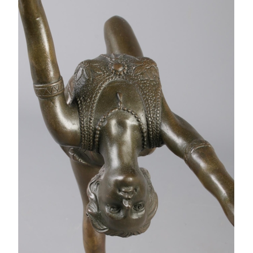 202 - An Art Deco style bronze figure modelled as a fire dancer, raised on marble base. Signed indistinct.... 