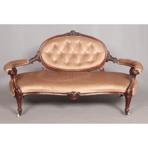 541 - A Victorian carved mahogany parlour sofa.