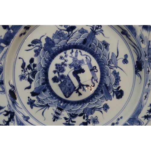 52 - An 18th century Chinese dish decorated in underglaze blue with landscapes and figures. Diameter 25.5... 