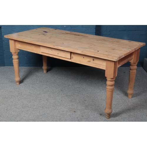 570 - A pine kitchen table with drawer to two sides. (80cm x 180cm x 86cm)