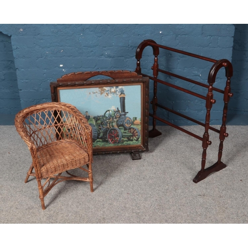 572 - A turned mahogany towel rail, fire screen with needlepoint of a steam tractor and a child's chair.