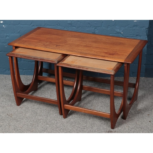 575 - A nest of three teak G Plan Egomme tables.