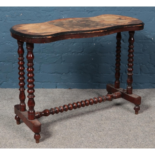 579 - A Victorian games table with bobbin turned supports and central bobbin stretcher. Height: 68cm, Widt... 