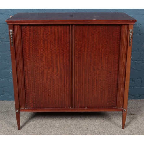 582 - A mahogany side cabinet with sliding tambour front sliding doors. (86cm x 89cm x 45cm)