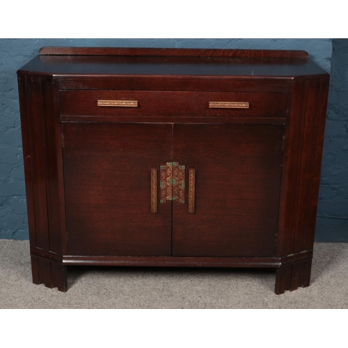 585 - An Art Deco oak sideboard. (94cm x 122cm)