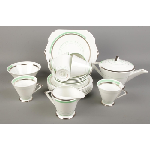 102 - An Art Deco Shelley tea service. Decorated with green and silvered borders.