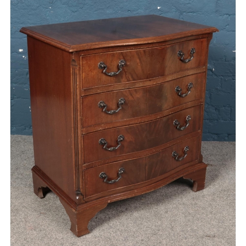 589 - A small mahogany serpentine four drawer chest.