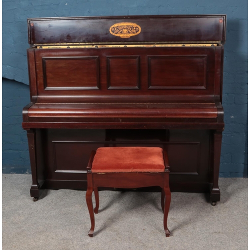 592 - A mahogany John Brinsmead & Sons overstrung upright piano with mahogany piano stool.