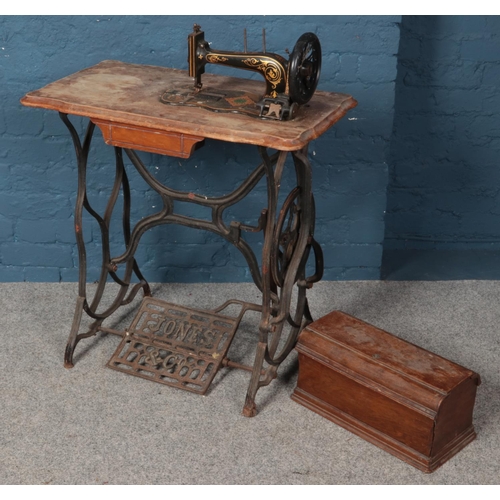 595 - A Jones & Co treadle sewing machine.