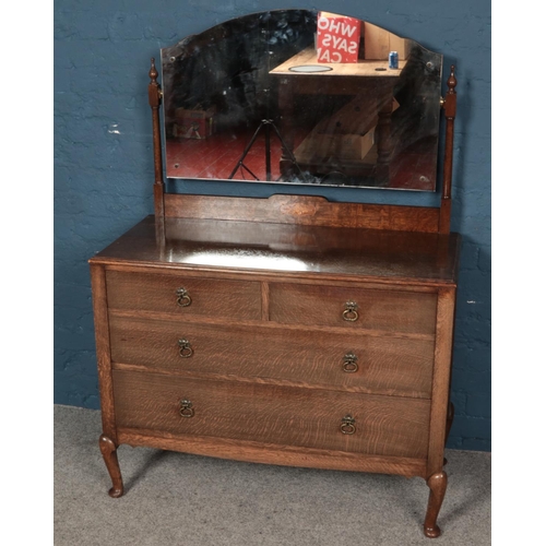 600 - An oak hinged mirror dressing table with inlay decoration to the base of mirror support and two over... 