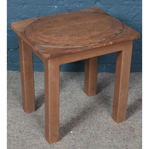 603 - An oak top table with painted metal base. (49cm x 46cm)