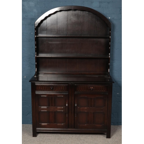 608 - A mahogany Priory style welsh dresser. (190cm x 121cm)