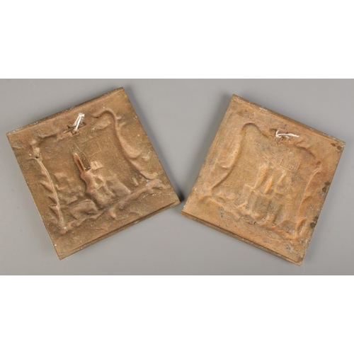 117 - A pair of cast bronze plaques, with scenes depicting Continental castles. 21.5cm x 20.5cm.