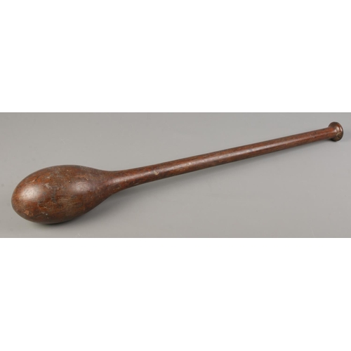 123 - An African wooden club. Length 67cm.