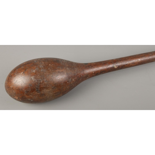 123 - An African wooden club. Length 67cm.