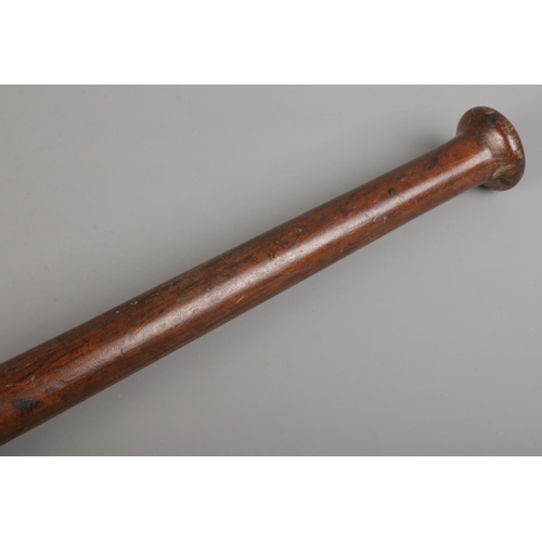 123 - An African wooden club. Length 67cm.