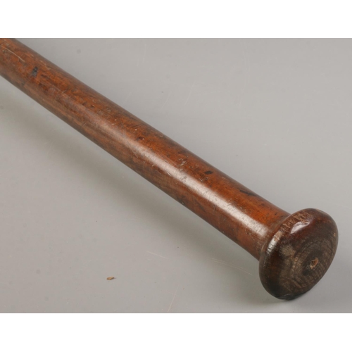 123 - An African wooden club. Length 67cm.