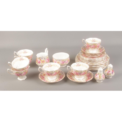 14 - A Royal Albert Serena tea set to include plates, teacups, milk jug and salt and pepper shakers. Appr... 