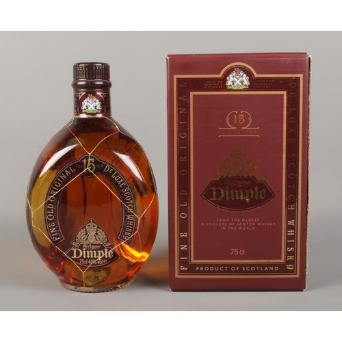 15 - A boxed and sealed bottle of Dimple 15 years old De Luxe Scotch Whisky (75cl).