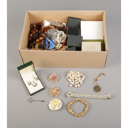 17 - A box of assorted costume jewellery including necklaces, brooches, earrings and bracelets.