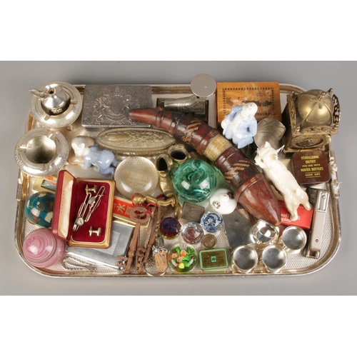 171 - A large tray of various collectables, to include brass lantern clock, Mdina paperweight, marquetery ... 