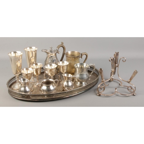 176 - A collection of silverplated items. Includes serving tray, Valero and Pinder Bros goblets etc.