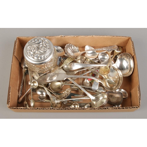 179 - A collection of miscellaneous flatware, to include ladles, tea strainers, souvenir spoons and sugar ... 