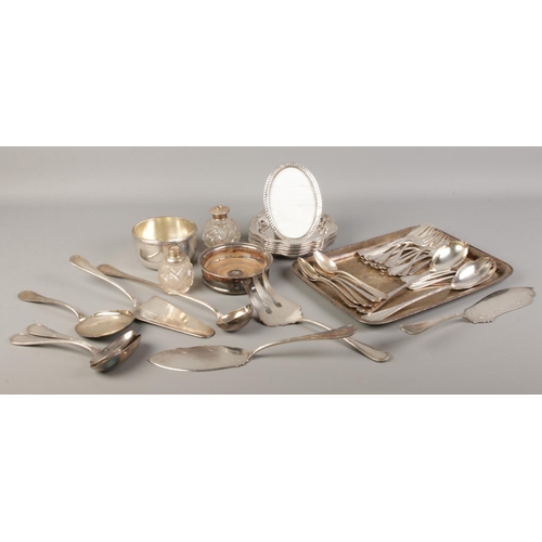 181 - A collection of silver and silver plated items to include silver oval photo frame, wine coaster and ... 