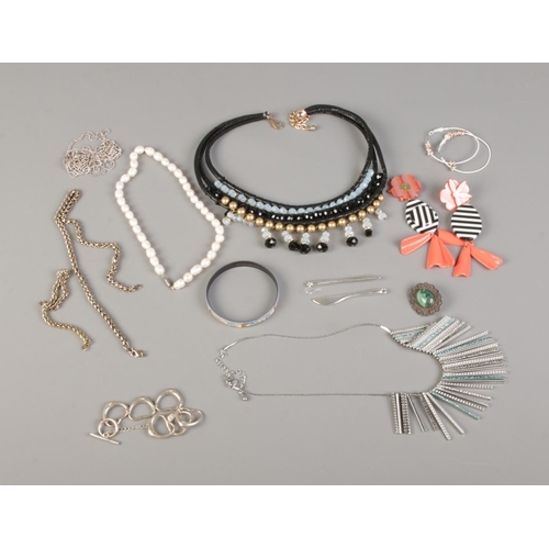 20 - A quantity of assorted costume jewellery including one silver  bracelet, necklaces and earrings.