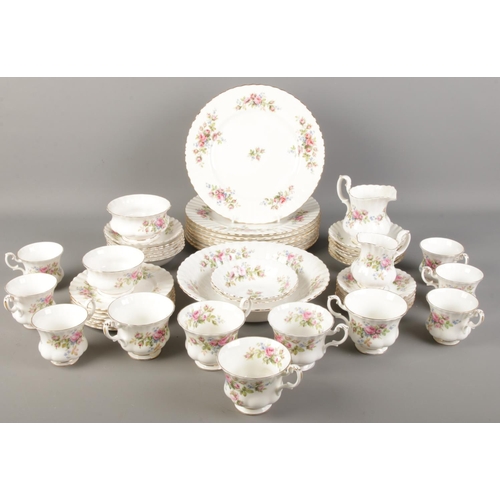 207 - A quantity of Royal Albert Moss Rose dinner/teawares. Including cups & saucers, sugar bowl, milk jug... 