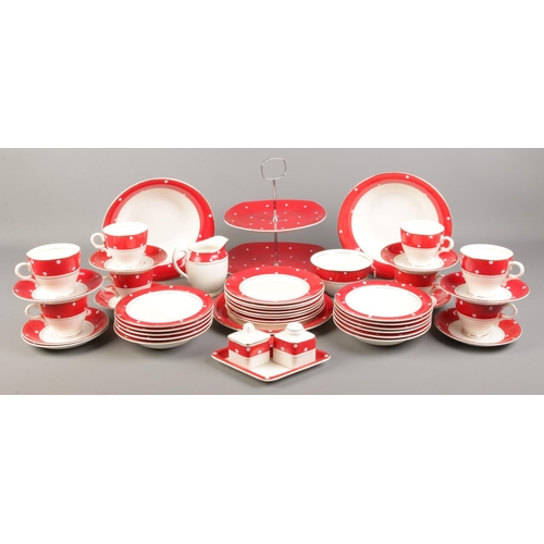 22 - A Crownford Burslem ceramic tea set, with red/white spot design, cups, saucers, side plates, milk ju... 