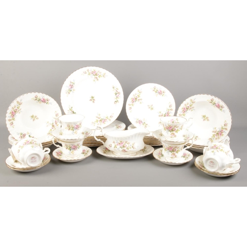 25 - A complete eight-place Royal Albert Moss Rose dinner service (42 pieces). To include soup bowls, cup... 