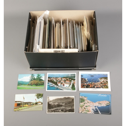 217 - A box of approx. 750 postcards dating from 1950 onwards. Includes European and American examples.