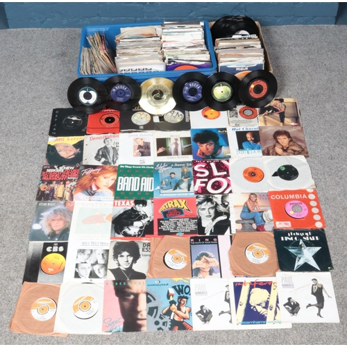 228 - A large collection of rock and pop single vinyl records. To include: John Lennon, Amen Corner, Paul ... 