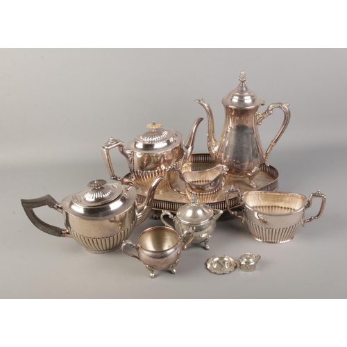 236 - A box of silver plate including coffee pot, decorate engraved tray and several teapots.