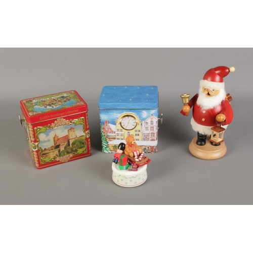 29 - A quantity of Christmas items including pair of German music tins, Schmid musical ornament and Fathe... 