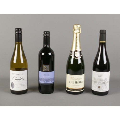 30 - A quantity of wine including Cotes Du Rhone, Malbec, Chablis and a bottle of The House Chapagne.