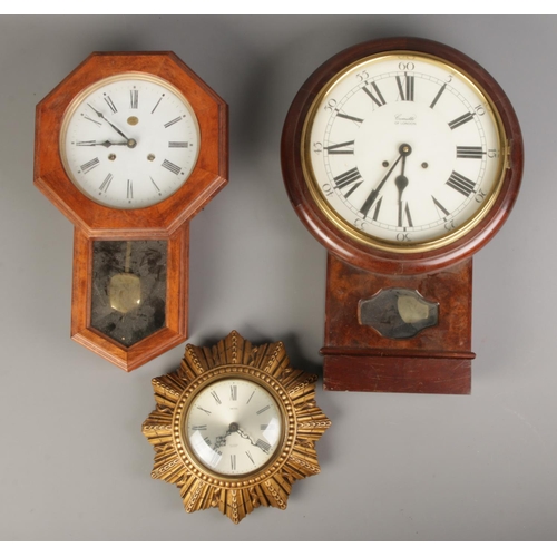 256 - A Smith's sunburst wall clock along with Rapport of London wall clock and another wall clock.