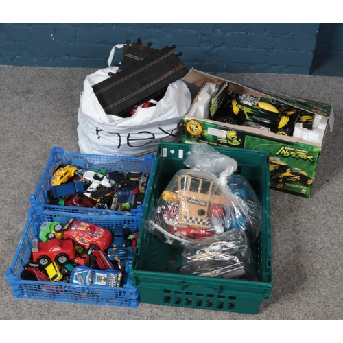 275 - A collection of diecast vehicles, Scalextric cars and track and a boxed radio controlled car.