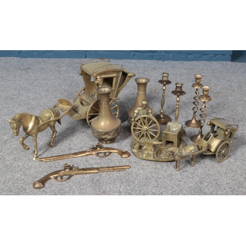 281 - A box of brasswares. Includes horse and carriage, Beldray vases, two pairs of candlesticks etc.