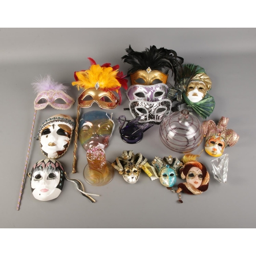 296 - A box of assorted Venetian style masquerade masks, including ceramic example and glassware.