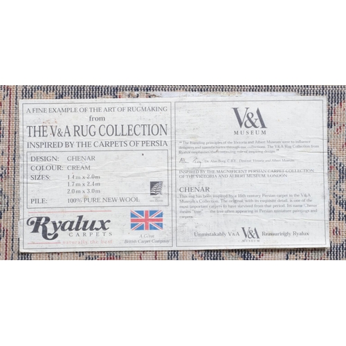 309 - A Ryalux Carpets cream ground wool rug. 240cm x 170cm.