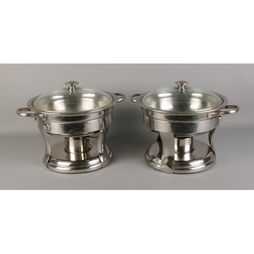 313 - A pair of cooking pots with detachable burners.