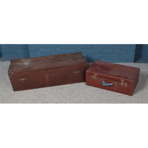 328 - A long wooden lockable trunk along with leather suitcase. Trunk approx. 1m wide.