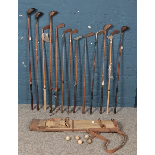 346 - A quantity of vintage golf clubs. Including Mashie, Arrow putter, Spalding, etc.