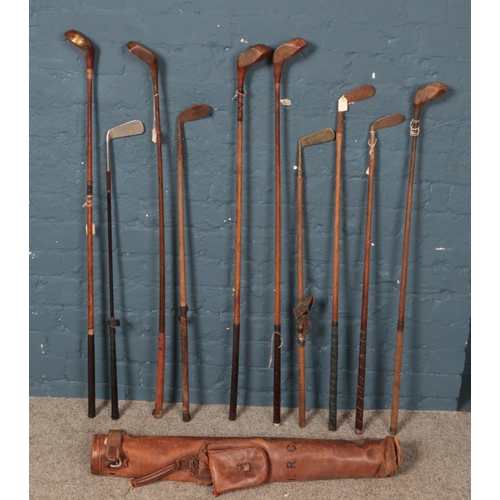 348 - A quantity of vintage golf clubs. Including W.Smithson Leyland putter, Macgregor, Pyramid putter,