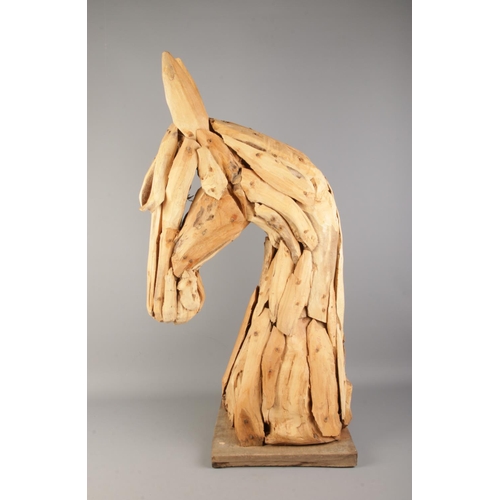 5 - A large decorative wooden sculpture of a horse's head. Approx. 90cm tall including base.