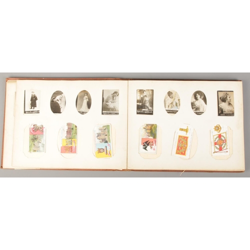 50 - A vintage Ogden's Photo Album with contents of cigarette cards. Includes Chairman Old Pottery & Porc... 